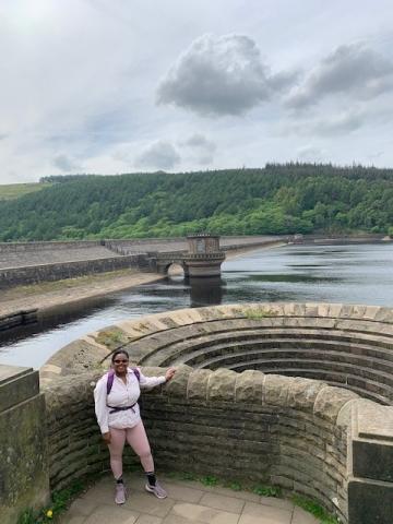 Alexandra Ismay poses in front of a water feature