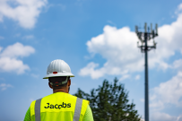 Jacobs telecommunications teammate preparing for a tower climb